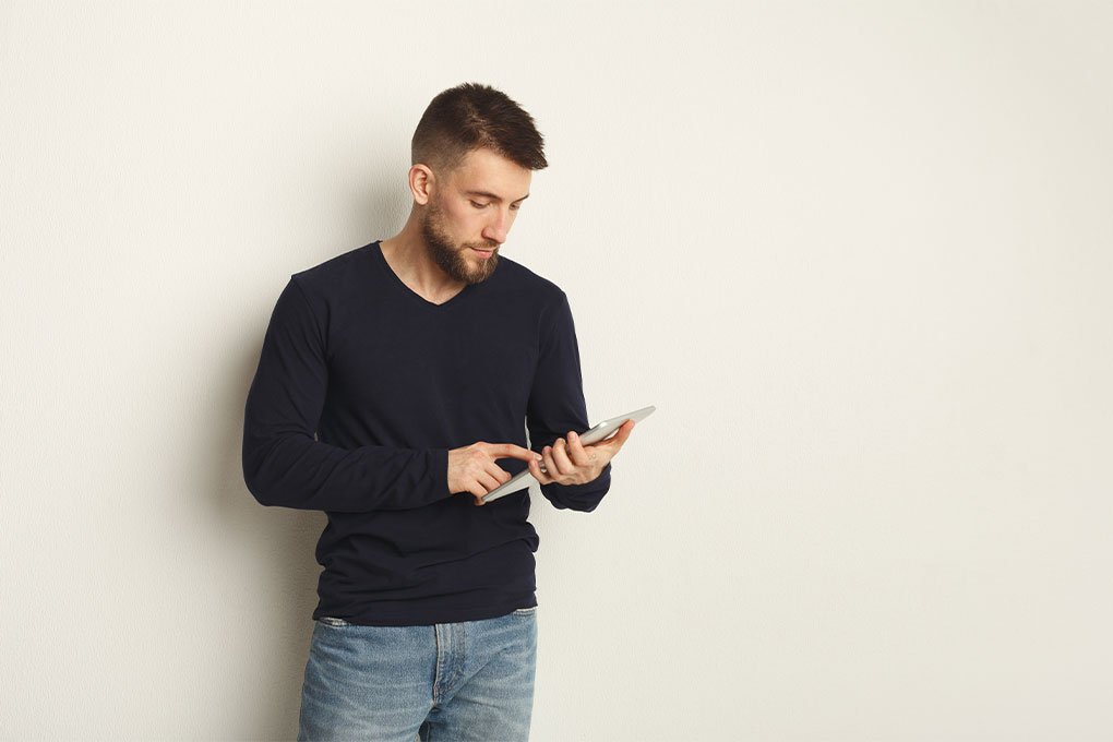 man on an ipad